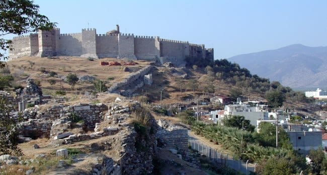 The walls and towers of Ayasuluk Castle above the town of Selçuk