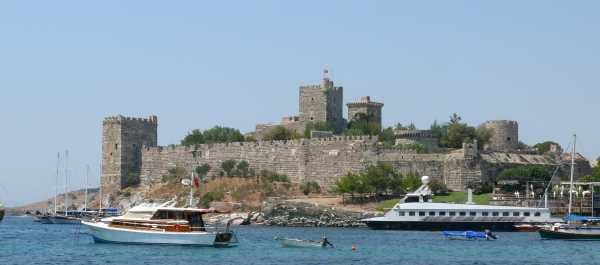 The Castle of St Peter above Bodrum harbour with gulets and boats moored in front of it