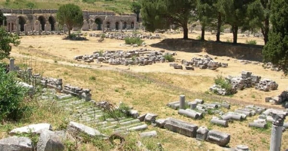 The open square of the commercial agora of Ephesus, ringed by fallen columns