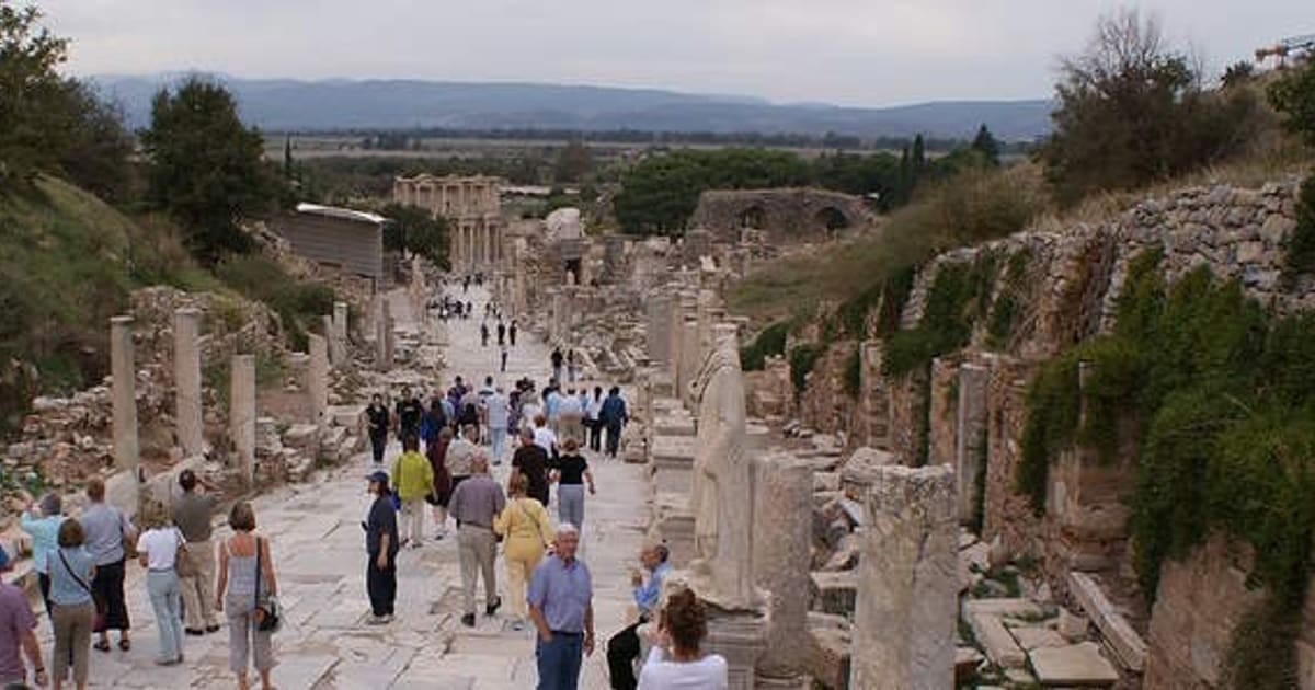 Visitors walking down Curetes Street in Ephesus toward the Library of Celsus