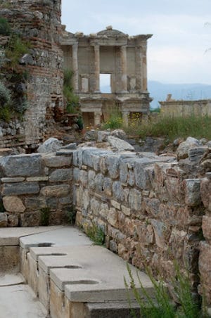 The Roman public latrines of Ephesus with the Library of Celsus behind