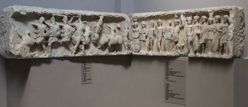 Two marble relief friezes from the Temple of Hadrian displayed on a wall in the Ephesus Archaeological Museum