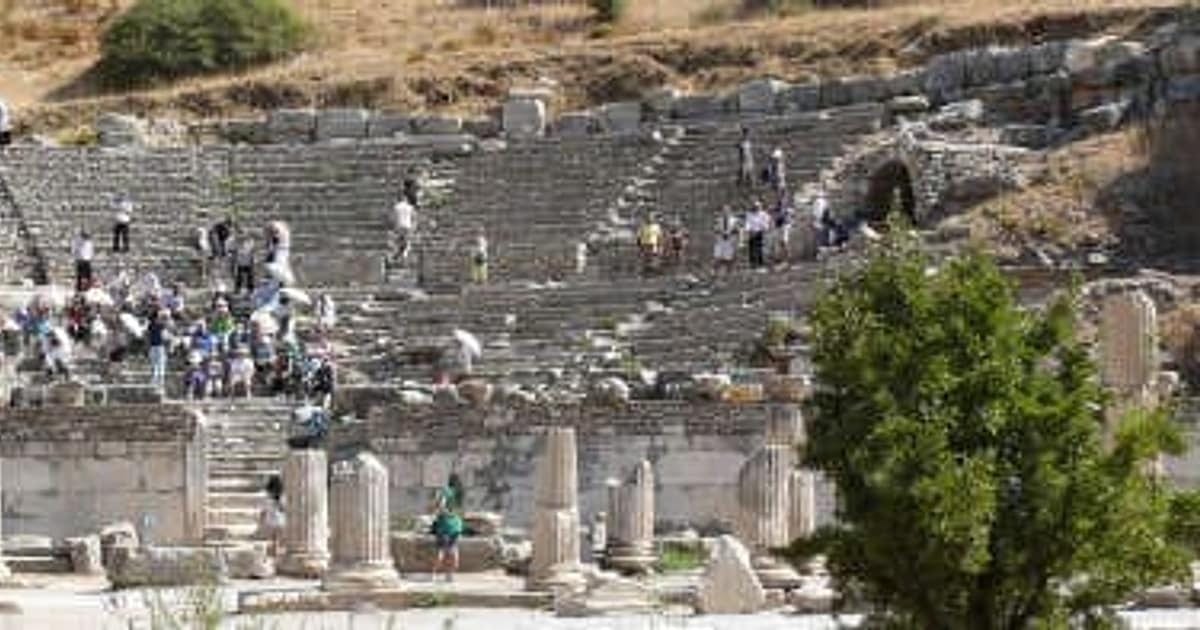 The vast hillside auditorium of the Great Theatre of Ephesus, filled with visitors