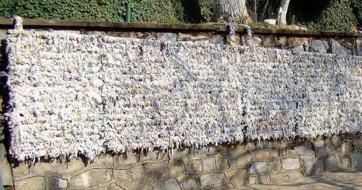 The wishing wall at the House of the Virgin Mary, covered with thousands of tied paper prayers