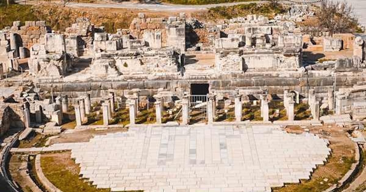 The stepped stone seating of the Odeon at Ephesus above the level road that runs past it
