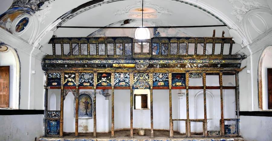 Interior of the old Greek Orthodox church at Şirince with a stripped wooden screen still showing blue and gold painted panels